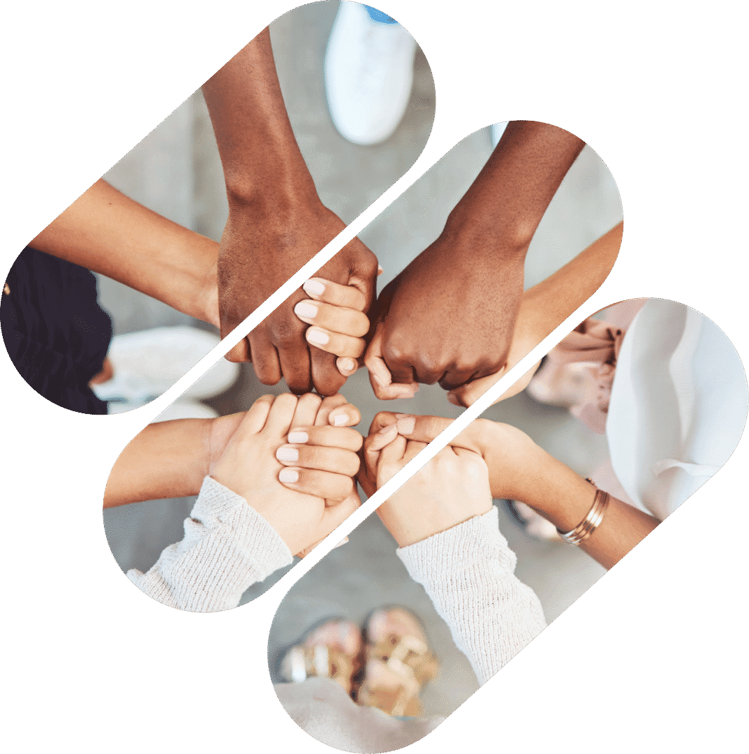 Diverse hands joined in unity gesture.