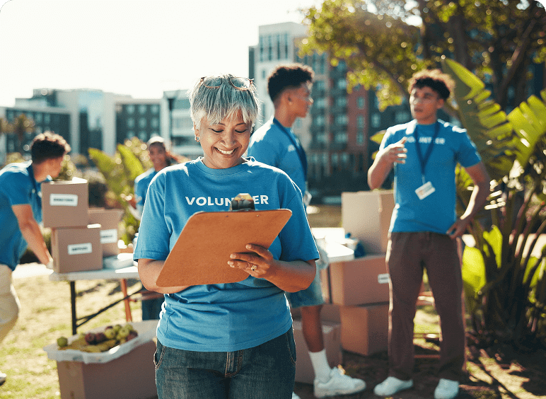 Volunteer team organizing outdoor charity event.